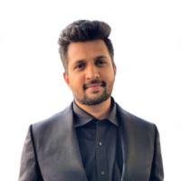 A professional headshot of Saurabh (Sky) Upadhya.